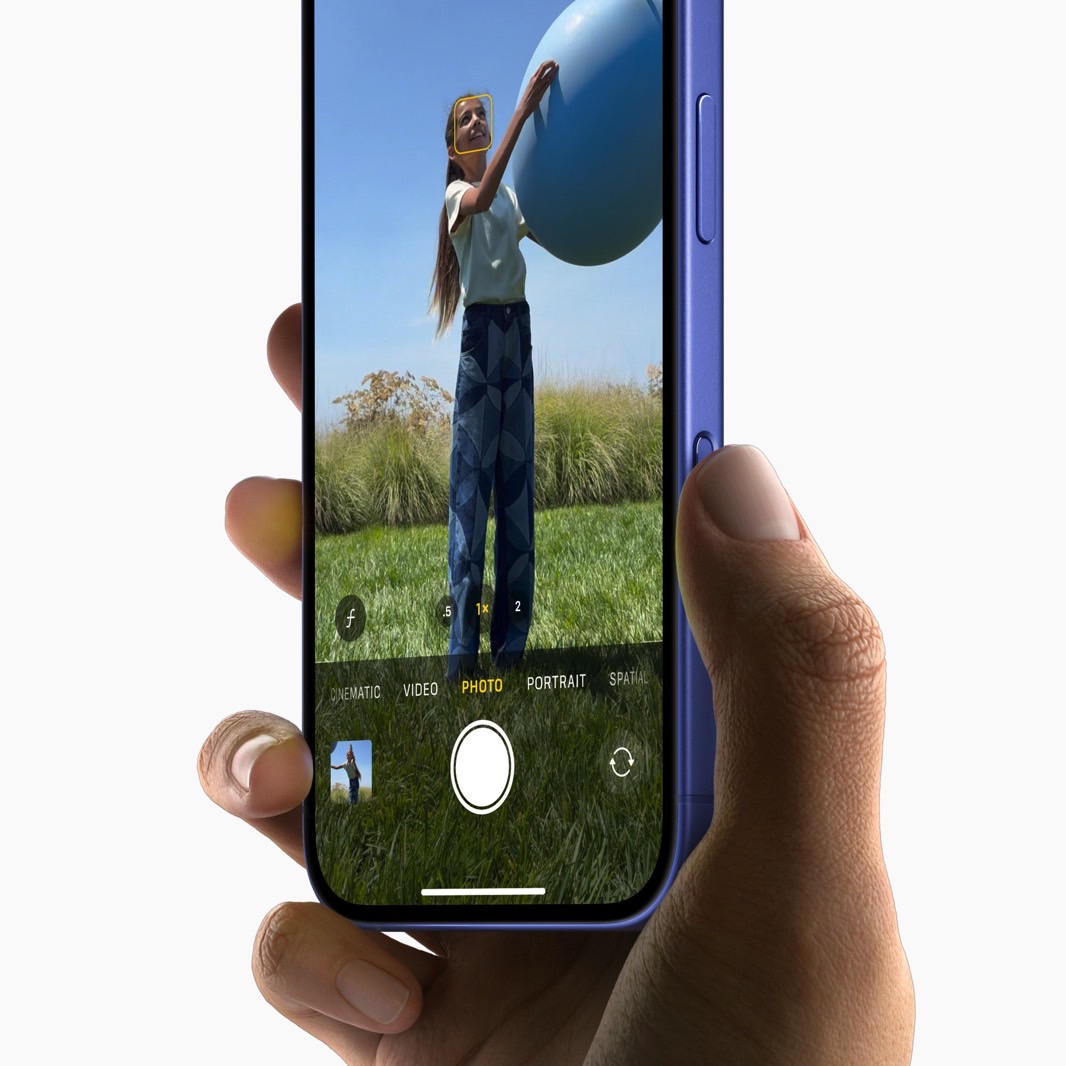 Using the Camera Control button to take a photo on the iPhone 16 and 16 Plus.