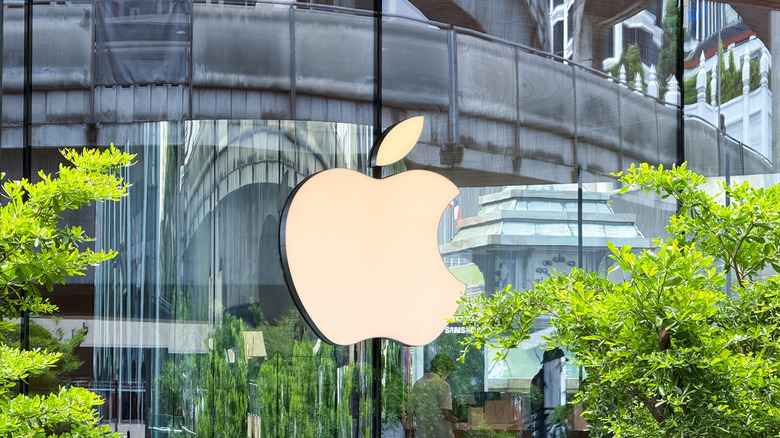 An Apple logo outside an Apple retail store.