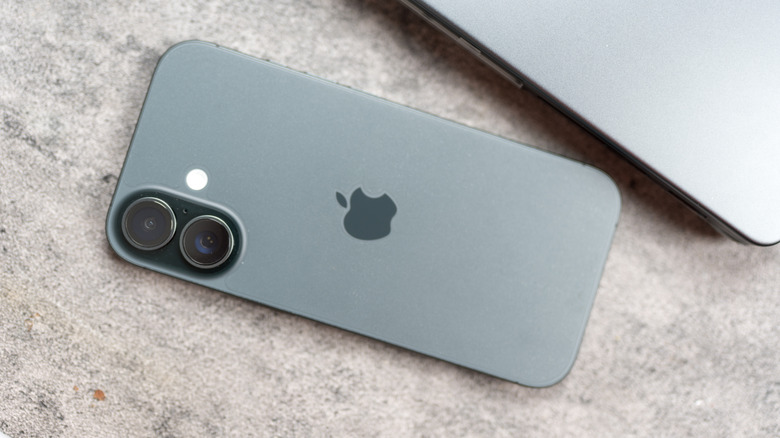 The standard iPhone 17 face-down on a table.